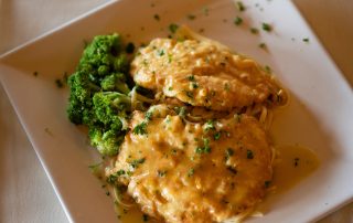 Chicken dish served with broccoli and pasta at Terrazza Greenfield restaurant